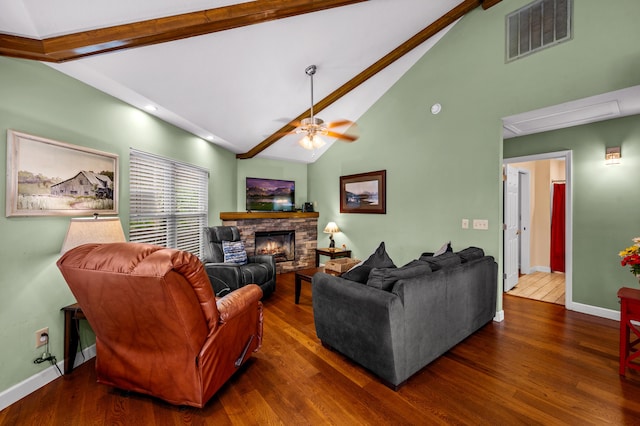 living room featuring a fireplace, beam ceiling, dark hardwood / wood-style floors, and ceiling fan