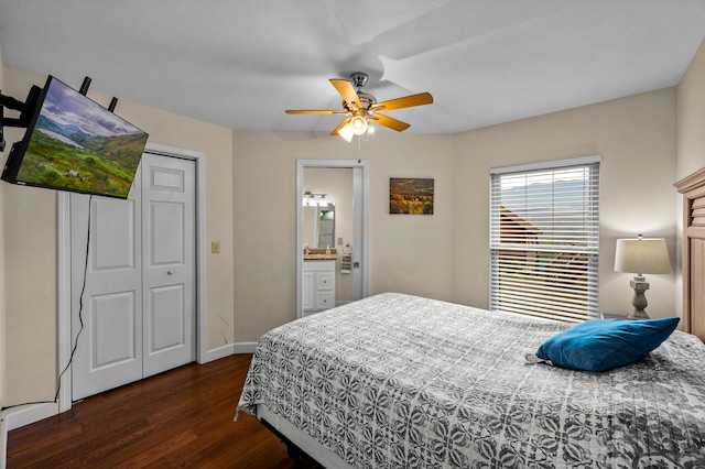 bedroom with ceiling fan, a closet, dark hardwood / wood-style flooring, and ensuite bath