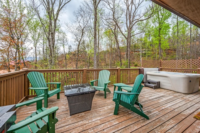 wooden deck featuring a fire pit