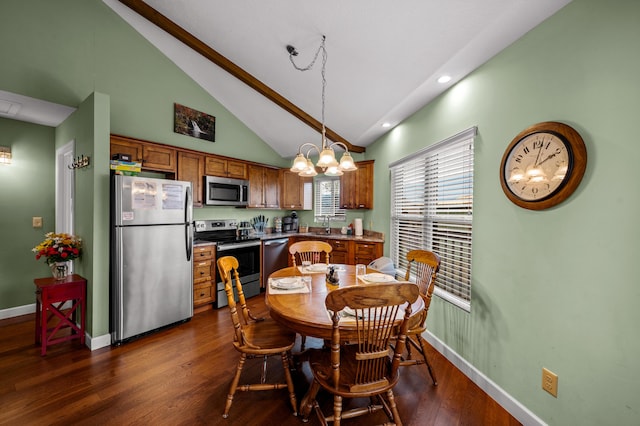 dining space with a notable chandelier, dark hardwood / wood-style floors, and high vaulted ceiling