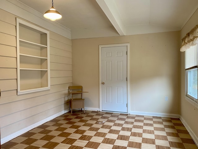 unfurnished room featuring built in features