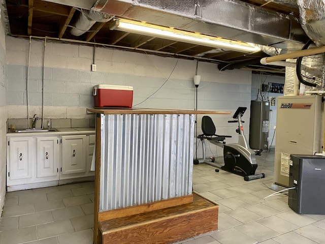 workout room with sink and water heater