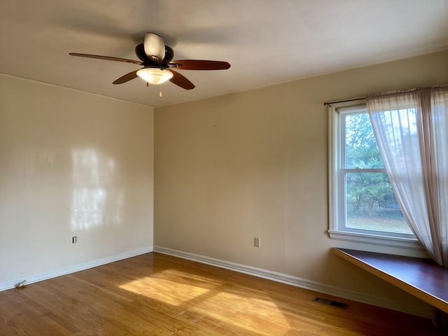 unfurnished room with ceiling fan and light hardwood / wood-style floors