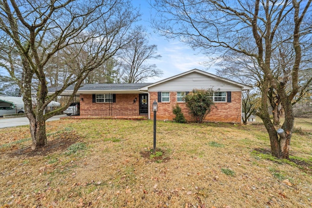 ranch-style home with a front lawn