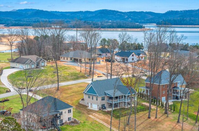 bird's eye view featuring a water and mountain view