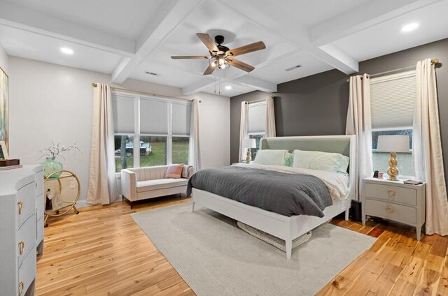 bedroom with coffered ceiling, light wood-style floors, beam ceiling, and recessed lighting