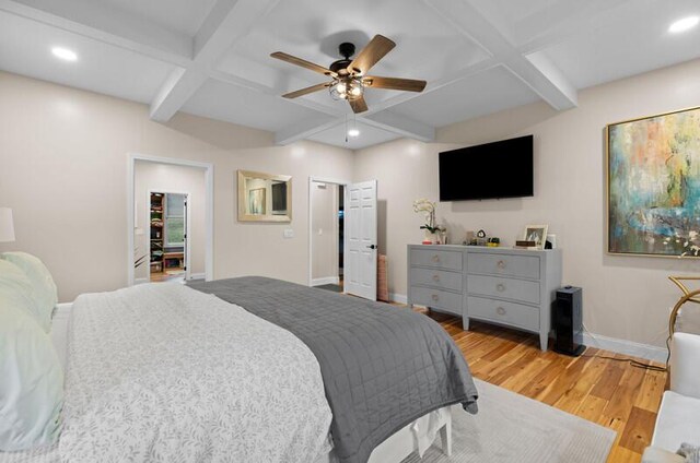 bedroom with coffered ceiling, recessed lighting, baseboards, beamed ceiling, and wood finished floors