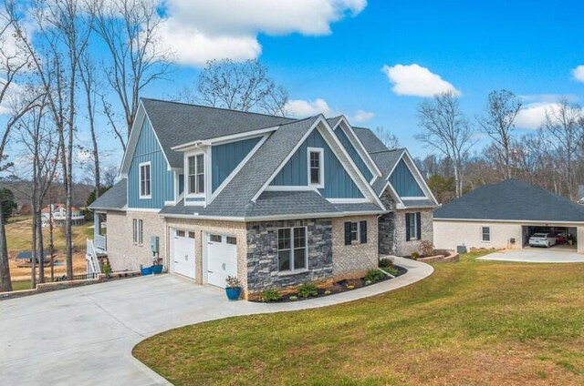 craftsman inspired home featuring concrete driveway, stone siding, board and batten siding, a front lawn, and a garage