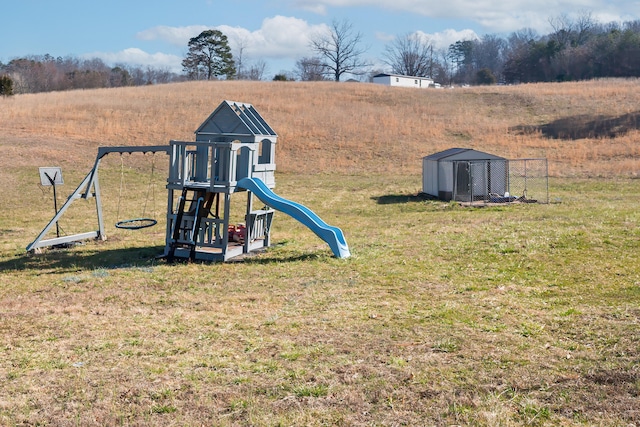 view of playground with a lawn