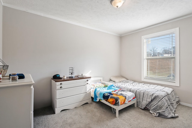 carpeted bedroom featuring a textured ceiling