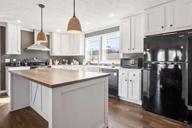 kitchen featuring white cabinetry, stainless steel appliances, dark wood-type flooring, and wall chimney range hood