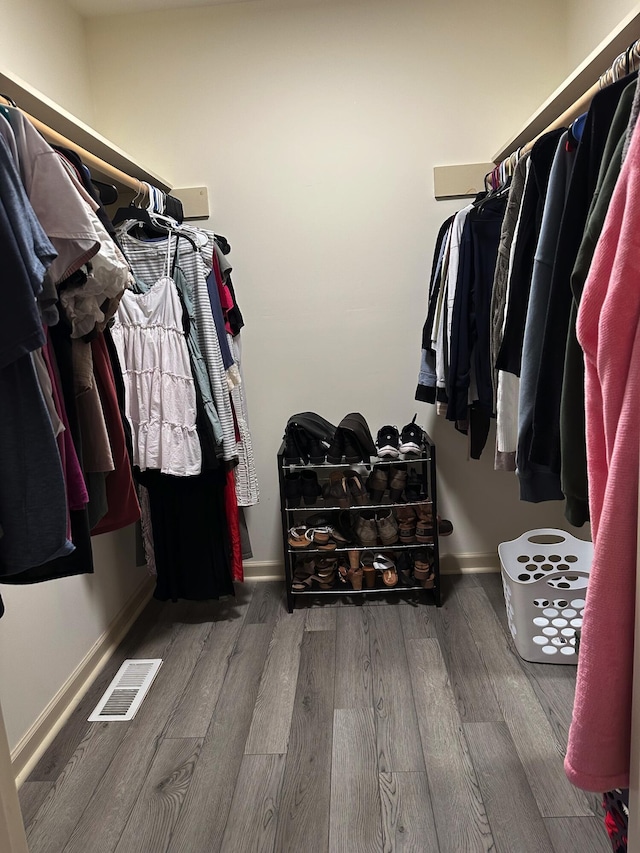 spacious closet featuring hardwood / wood-style floors