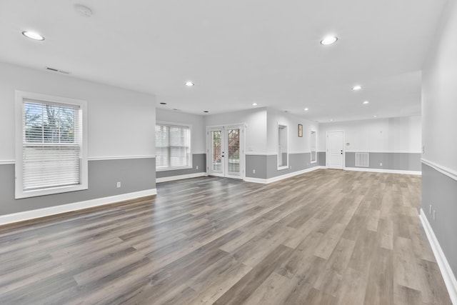 unfurnished living room featuring light hardwood / wood-style floors