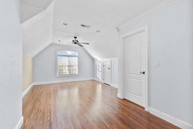 additional living space with ceiling fan, wood-type flooring, and lofted ceiling