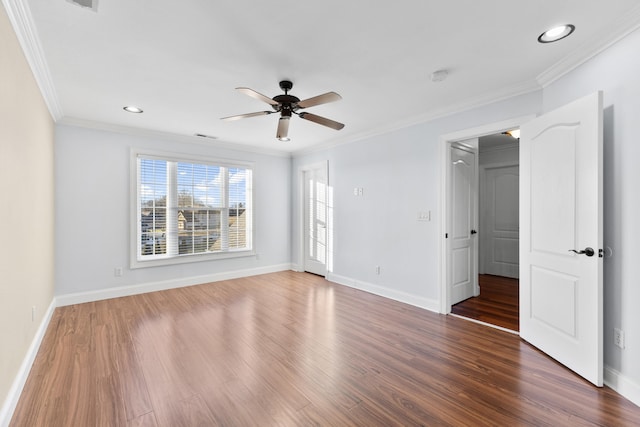 unfurnished bedroom with ceiling fan, dark hardwood / wood-style flooring, and crown molding