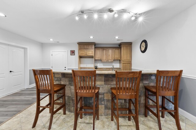 bar featuring dark hardwood / wood-style floors