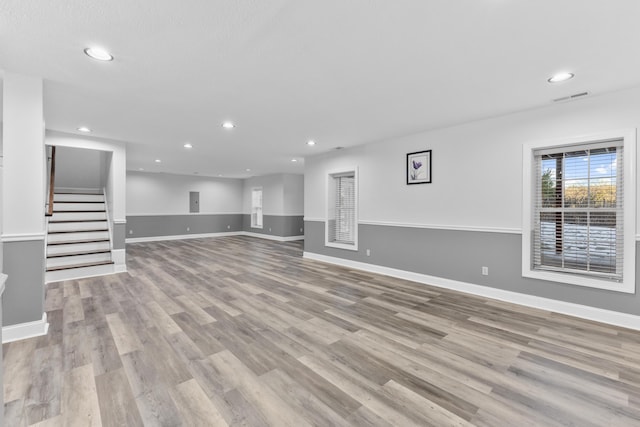 unfurnished living room featuring light hardwood / wood-style flooring