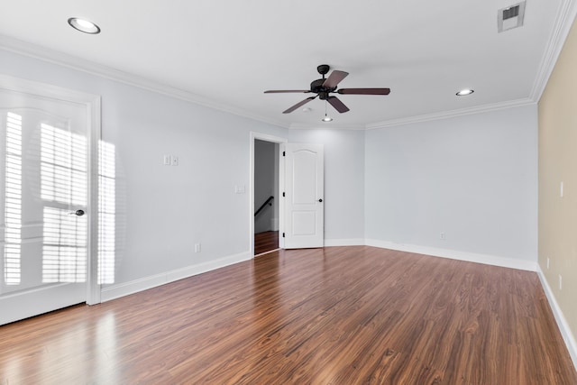 spare room featuring ceiling fan, wood-type flooring, and ornamental molding