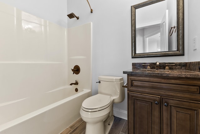 full bathroom with bathtub / shower combination, toilet, and vanity