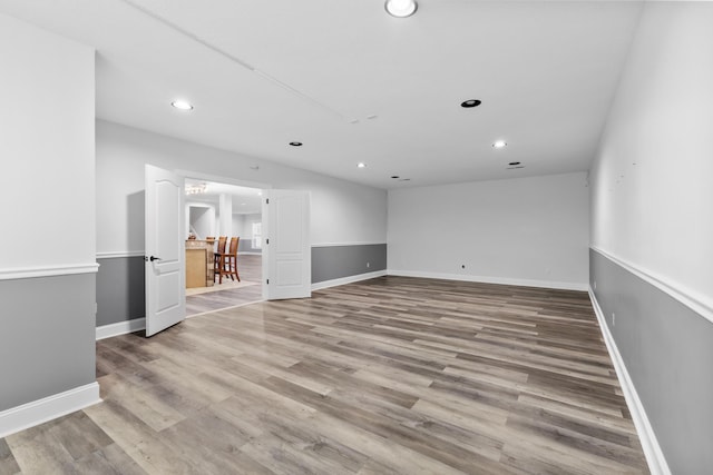 unfurnished room with light hardwood / wood-style floors