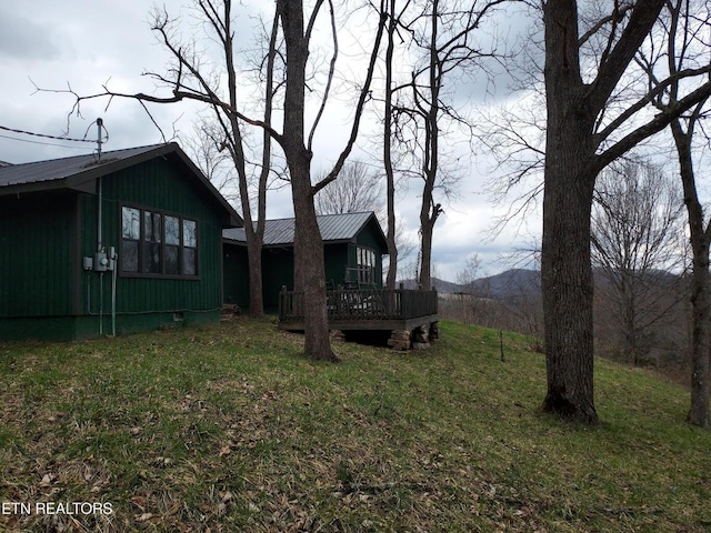 view of yard with a wooden deck