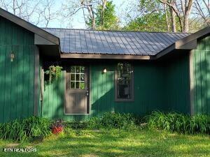 view of outdoor structure with a lawn