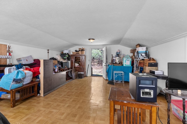 additional living space with vaulted ceiling and a textured ceiling