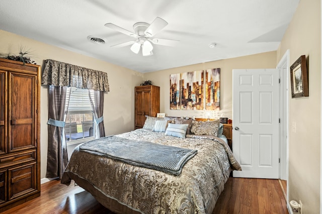 bedroom featuring ceiling fan and hardwood / wood-style flooring