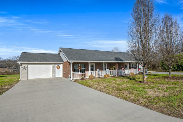 ranch-style house with a porch, a garage, and a front lawn