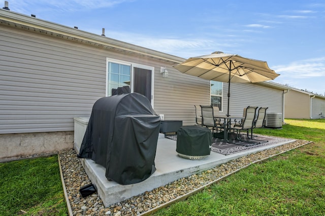 view of patio with area for grilling and central air condition unit