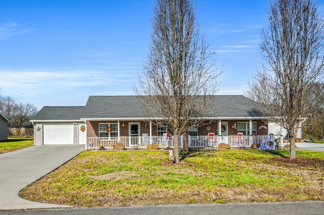 ranch-style home with a front lawn, covered porch, and a garage