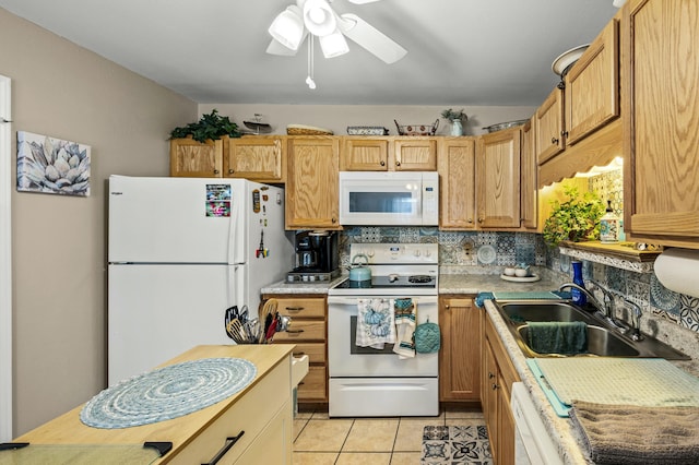 kitchen featuring tasteful backsplash, white appliances, ceiling fan, sink, and light tile patterned flooring