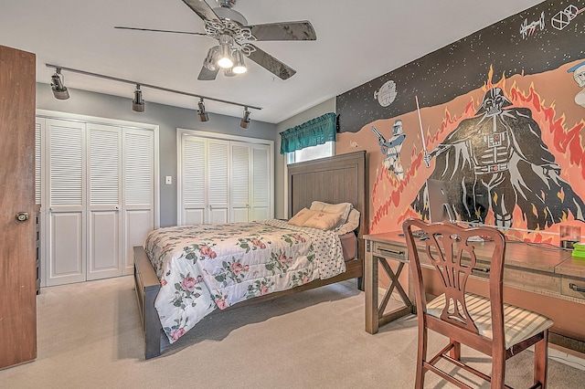310 Par Ln, Greeneville, TN 37743 - carpeted bedroom featuring track lighting, a ceiling fan, and two closets
