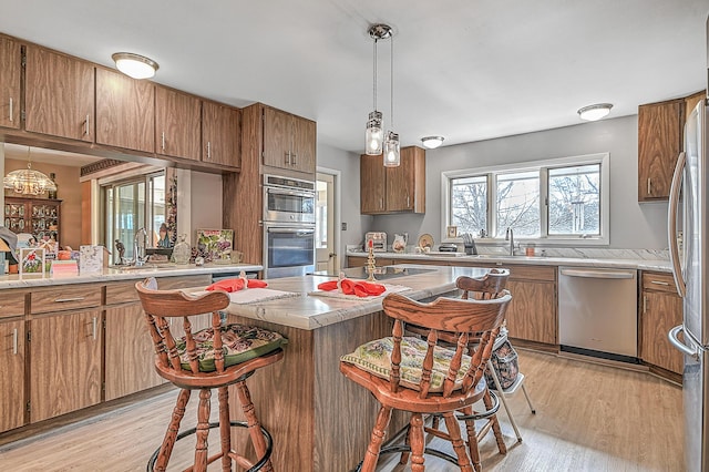 310 Par Ln, Greeneville, TN 37743 - kitchen featuring a sink, light wood finished floors, appliances with stainless steel finishes, and light countertops