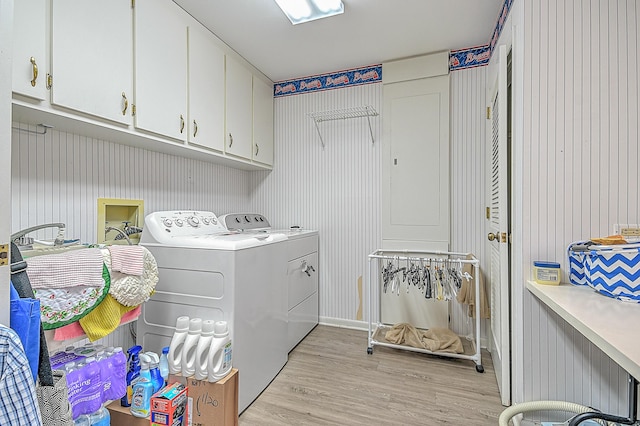 310 Par Ln, Greeneville, TN 37743 - laundry area with light wood-type flooring, cabinet space, and washer and dryer