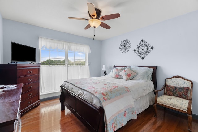 bedroom with wood finished floors and ceiling fan