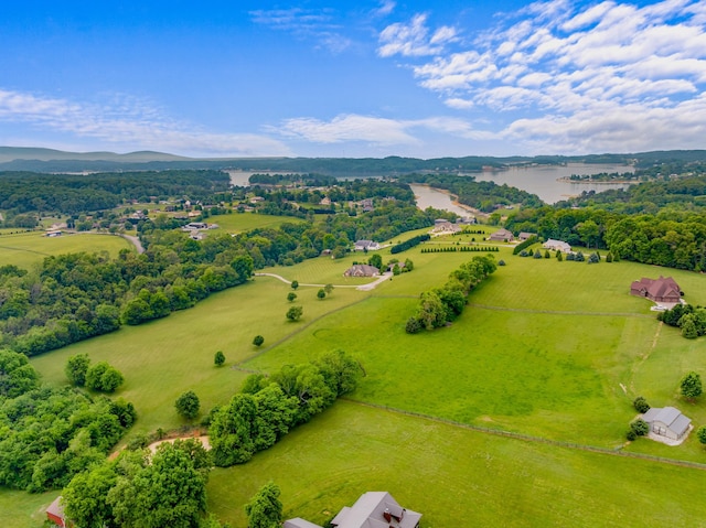 birds eye view of property with a rural view