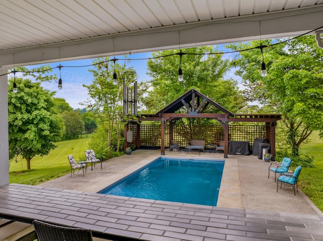 view of swimming pool with a gazebo, a patio area, a fenced in pool, and a lawn