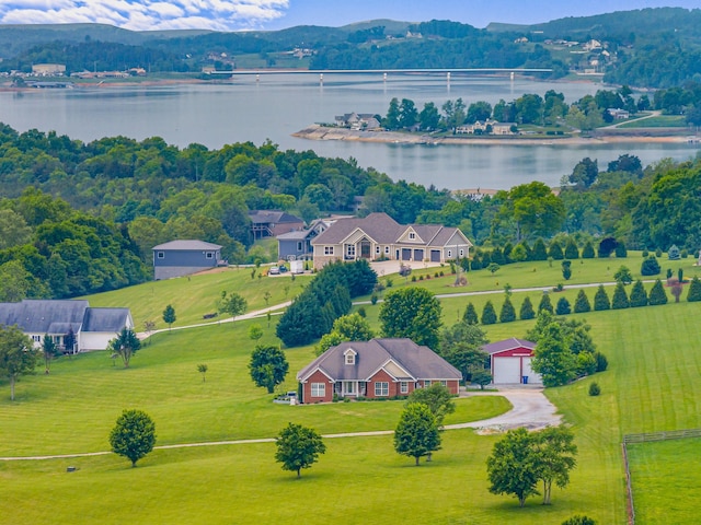 drone / aerial view featuring a water and mountain view