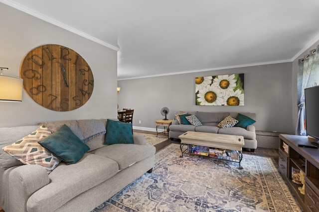 living room with crown molding, wood finished floors, and baseboards