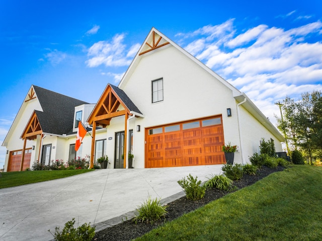 modern inspired farmhouse with a front lawn