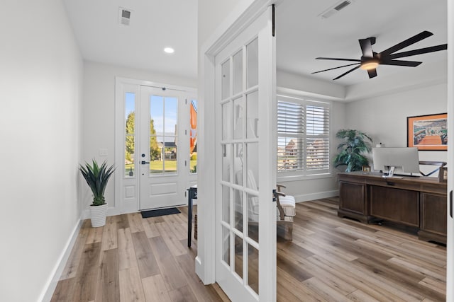 interior space featuring french doors, light hardwood / wood-style flooring, and ceiling fan