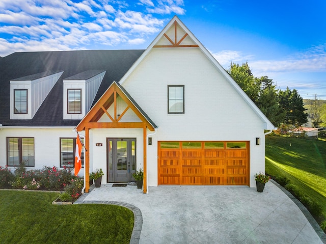 modern farmhouse style home with a front yard and french doors