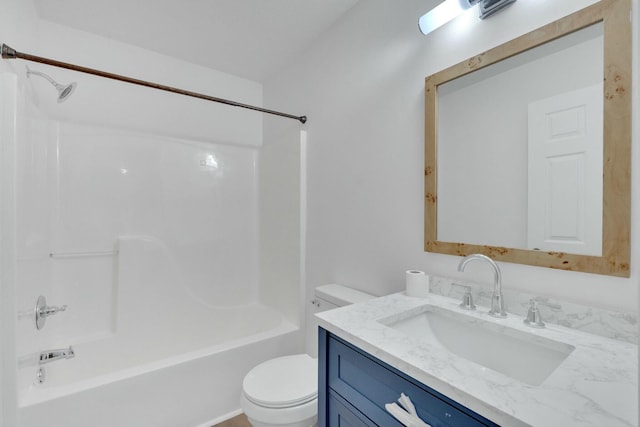 full bath featuring vanity, washtub / shower combination, and toilet