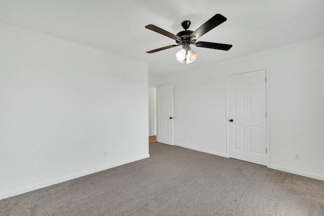 unfurnished bedroom featuring baseboards, carpet, and ceiling fan