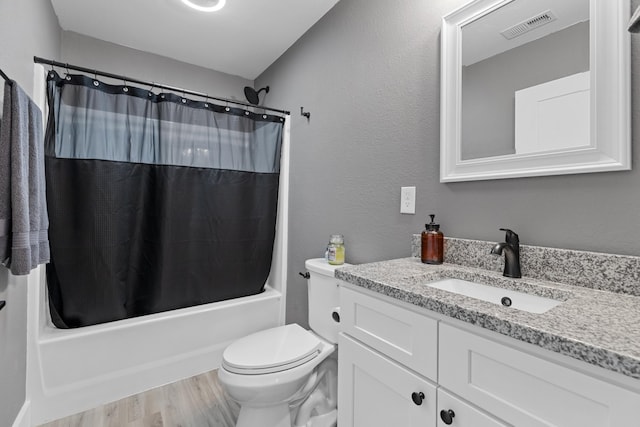 full bathroom with toilet, vanity, wood finished floors, and shower / tub combo with curtain