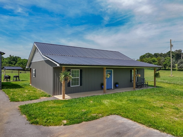 1131 Fate Rankin Rd, Jefferson City, TN 37760 - view of front of house with a front lawn, a metal roof, and a patio