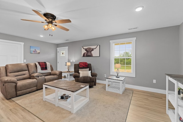 living room with a ceiling fan, light wood finished floors, baseboards, and recessed lighting