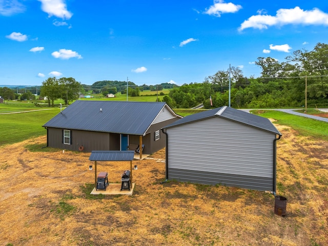 view of side of property with a lawn