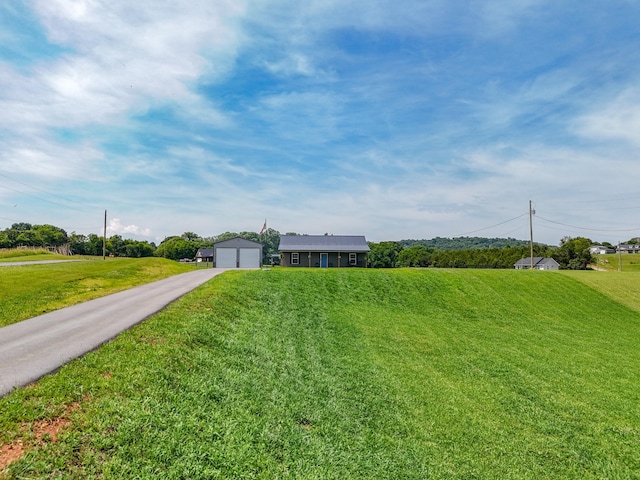 1131 Fate Rankin Rd, Jefferson City, TN 37760 - single story home featuring a detached garage, a front lawn, and an outdoor structure